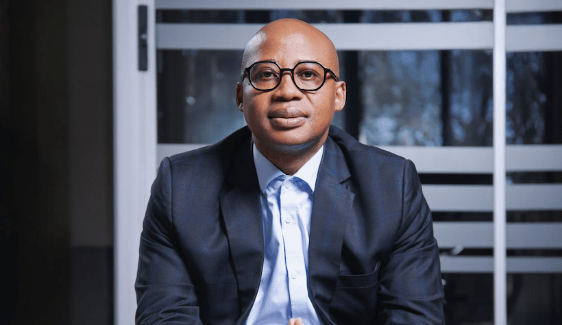 Dr Danny Tong South African businessman sitting portrait in formal suit